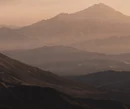 Layered mountain landscape at sunset